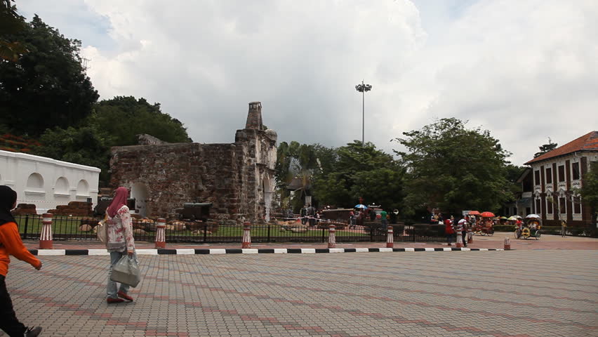MALACCA, MALAYSIA - NOV 4: Timelapse of trishaw driving in front of A Famosa in Malacca, Malaysia on 4th November 2012