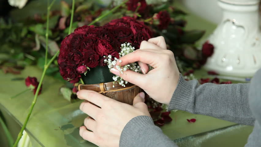 Female Hands Arranging Valentines Day Rose Heart Bouquet In Flower Shop Closeup