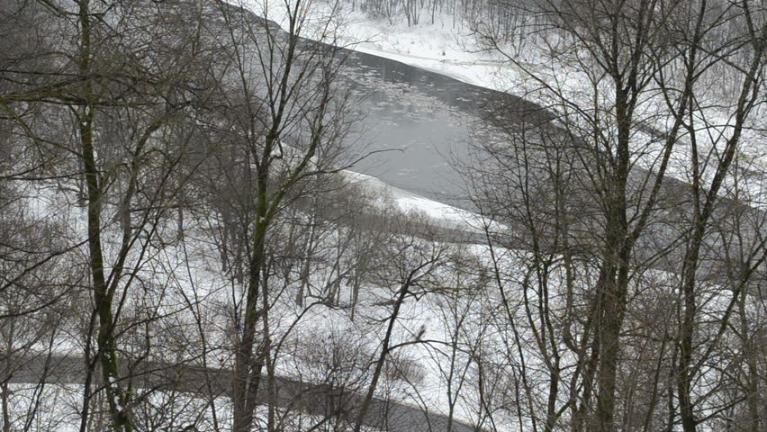neris river flow with floe downhill in winter park