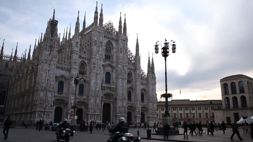 MILAN, ITALY - DECEMBER 29, 2011 Tourists walk near Milan Cathedral (Duomo di Milano), Duomo Square (Piazza del Duomo)