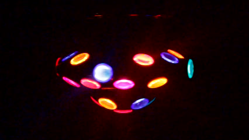 Disco ball toy spinning around in dark