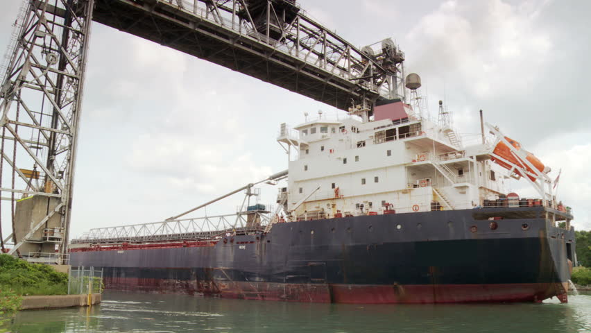 Freighter moving under lift bridge along the Welland Canal towards Lake Ontario