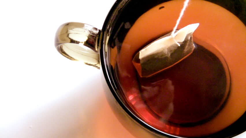 Dipping teabag into a cup, HD