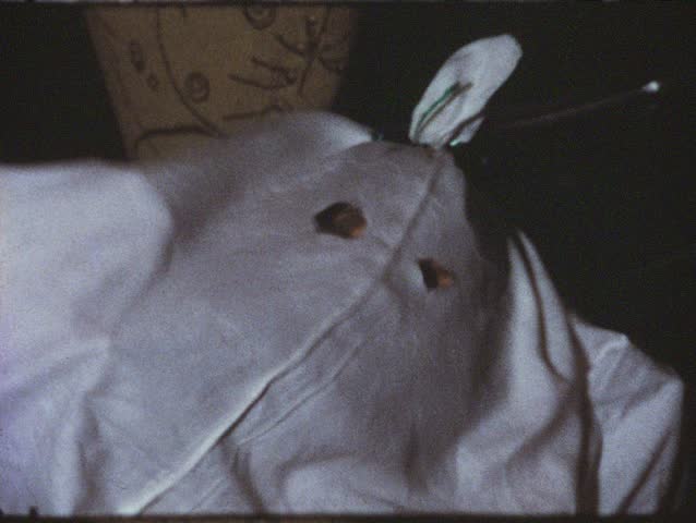 Vintage 8mm film: Girl under sheet, disguised as ghost, 1970s