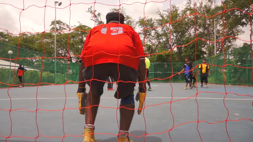 KUALA LUMPUR - FEB 24: Penalty kick during the neighborhood sports futsal competition in Taman Sri Rampai, Kuala Lumpur, Malaysia on Sunday, February 24, 2013.