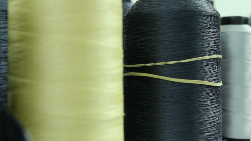 Tracking shot next to cotton thread