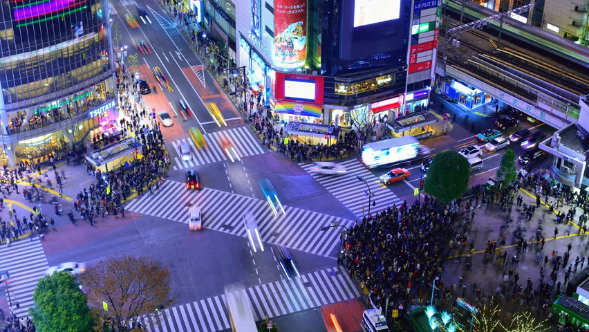 TOKYO - DECEMBER 23: Shibuya Crossing December 23, 2012 in Tokyo, JP. The crossing is one of the world's most famous examples of a Scramble Crosswalk.