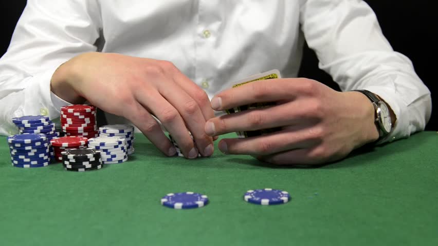 Poker player placing a bet