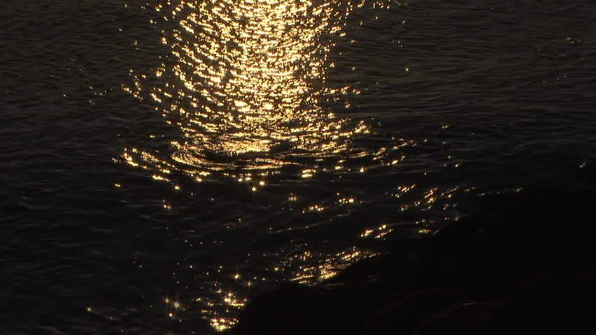 Sunlight path reflection on sea at sundown