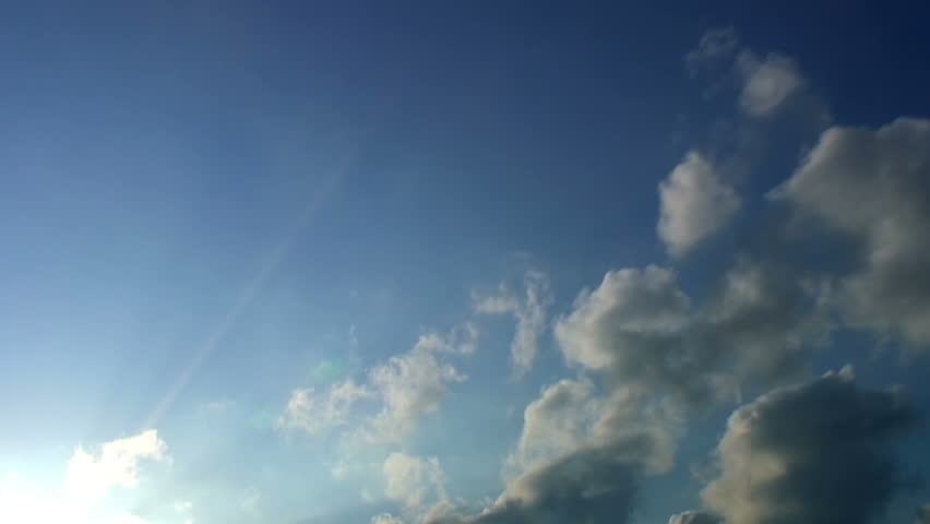 Cloud time lapse with light piercing through the clouds. HD 1080