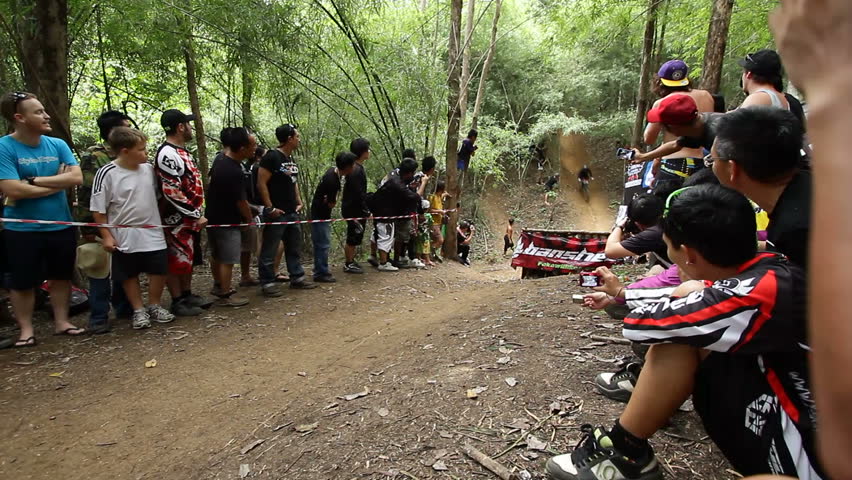 SANKAMPANG, CHIANGMAI, THAILAND - OCTOBER 21:   Unidentified downhill mountain biker crash in long jump downhill in Chiangmai Downhill Challenge Event on October 21, 2012 in Chiangmai, Thailand.