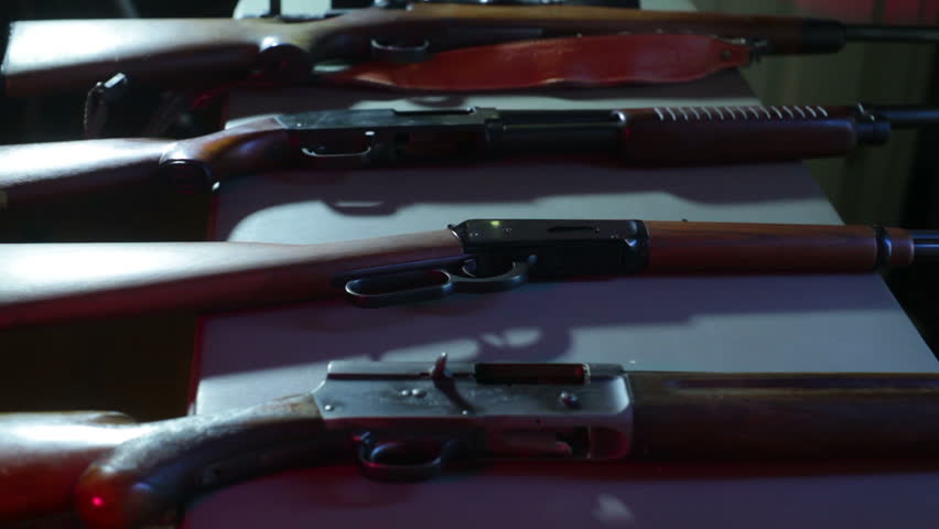 Guns at a gun show. 
Studio area, fake setup