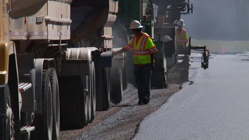 MISSOULA, MONTANA - CIRCA 2010: Crew and machines repairing the highway
