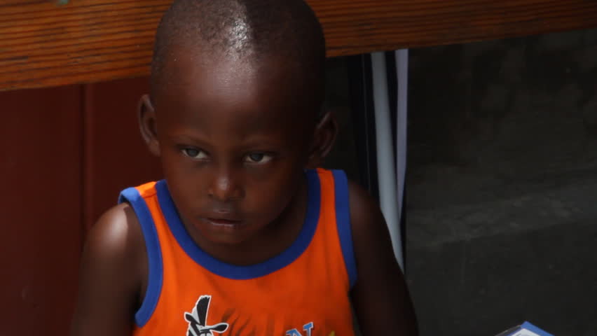 HAITI - CIRCA MAY 2012: young Haitian boy, closeup waiting  to receive vaccination in Port-Au-Prince clinic. 