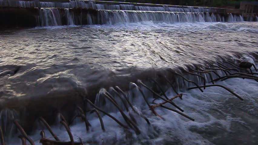 Footage of waterfall at dam