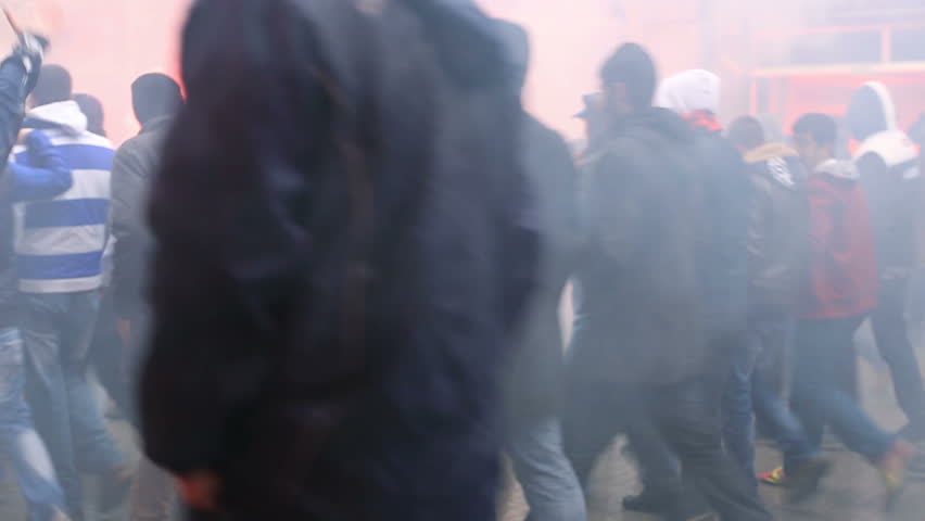 ISTANBUL - MARCH 17: Big crowd demonstrating on Istiklal Avenue and police response on March 17, 2013 in Istanbul, Turkey.