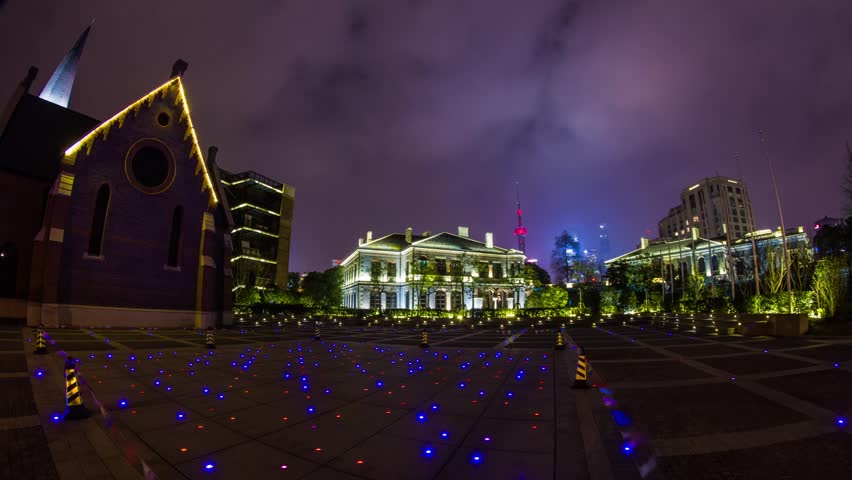 Time Lapse Cloudy Sky in front of a Church with Floor Lights at The Bund in Shanghai, China