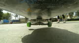 Riding a skateboard down an urban street