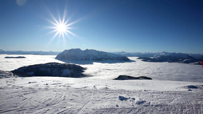 couple on skies having amazing view on a sunny winter day