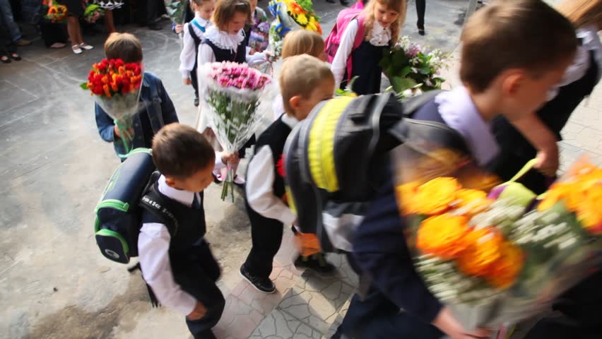 MOSCOW - SEP 1: Children with flowers for first day enter the school, on sept 1, 2011 in Moscow, Russia. 