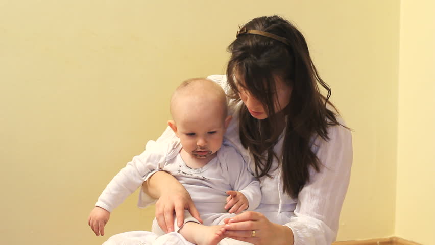Baby gesture, mother pointing finger and baby imitating her