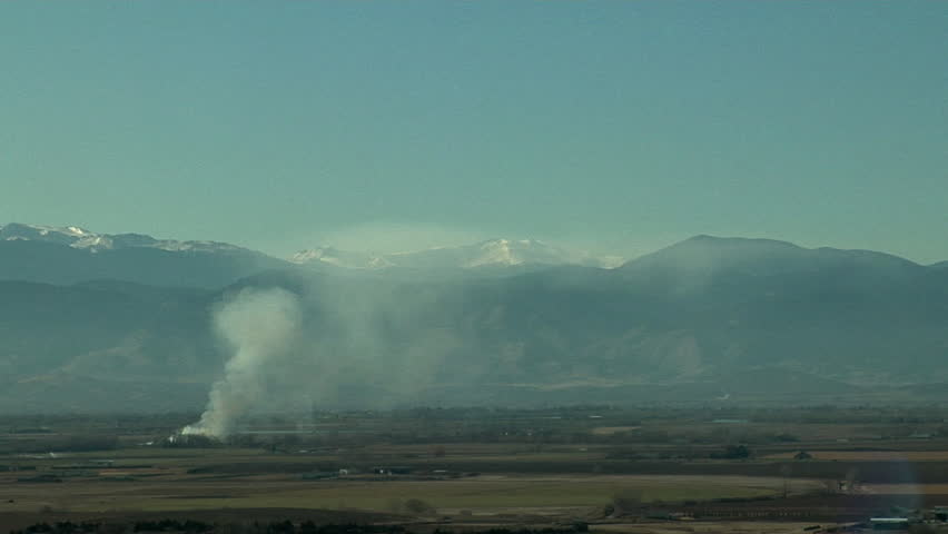 Wavy Triptopause. Smoke from brush fire rises to top of mixed layer which then shows gravity waves. This top of the mixedlayer is called the triptopause.