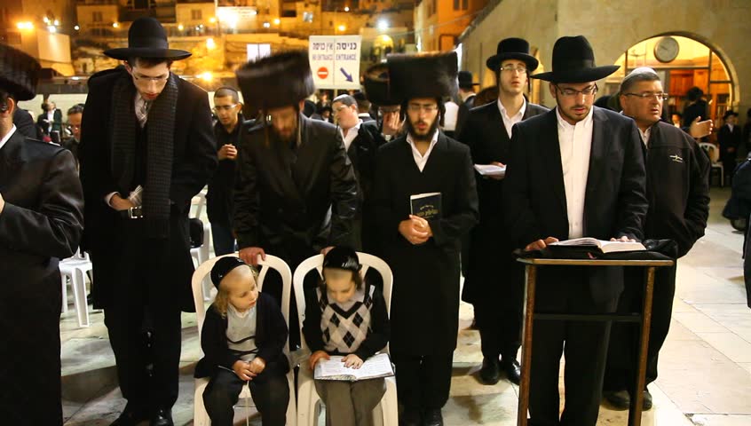JERUSALEM, ISRAEL -  MARCH 27: Jews pray in the Western Wall in the night before the Priestly Blessing  (Hebrew - Birkat Cohanim) during the Passover Holiday, March 27 2013 in Jerusalem, Israel.