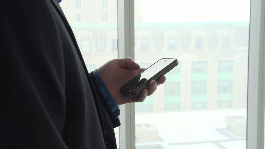 Business man on his smart phone
