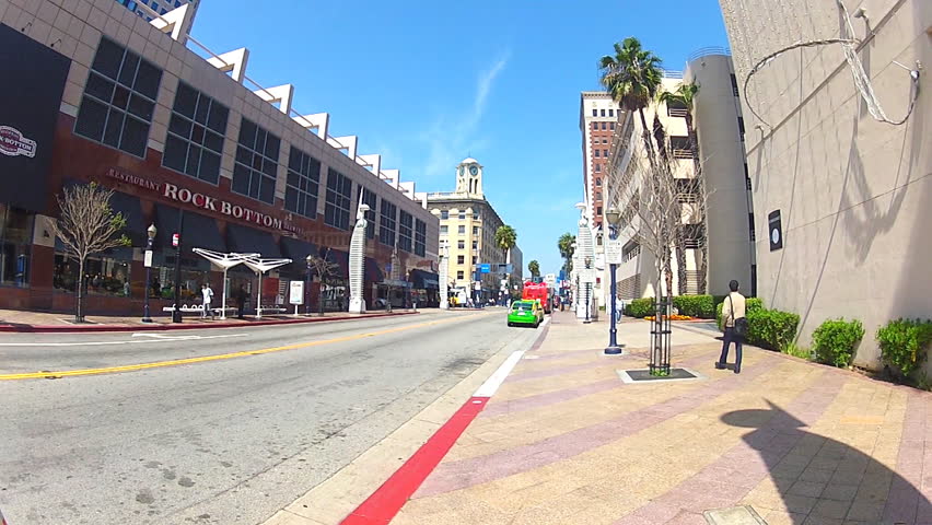 LONG BEACH, CA - APRIL 2, 2013: Pine Avenue or Street on a sunny weekday circa 2013 in Long Beach. Downtown Long Beach has undergone a revitalization to make it tourist and business friendly.