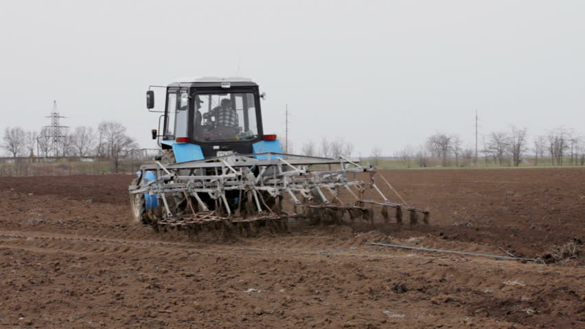 Tractor working on the filed.