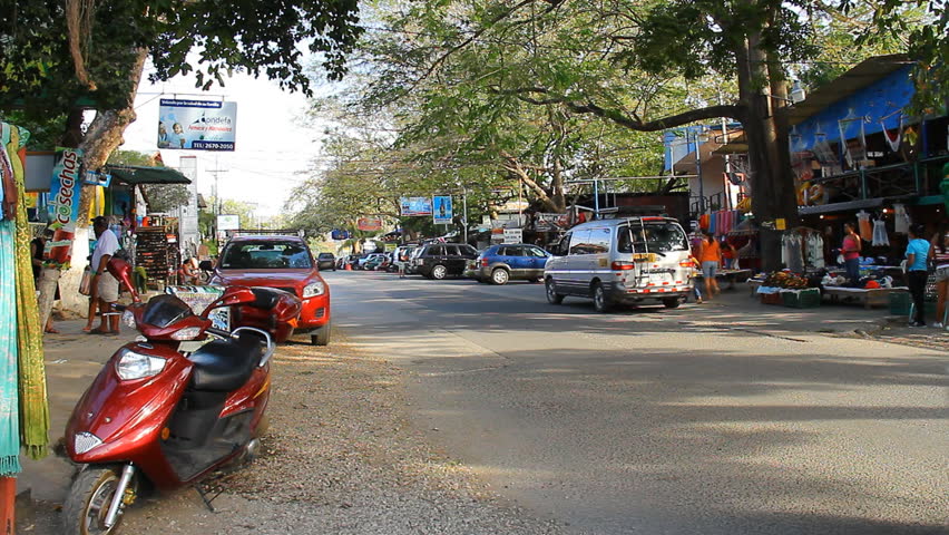 COSTA RICA - MAR 2013: The shopping strip of Playas del Coco with tourists and locals in Costa Rica, March 2013.