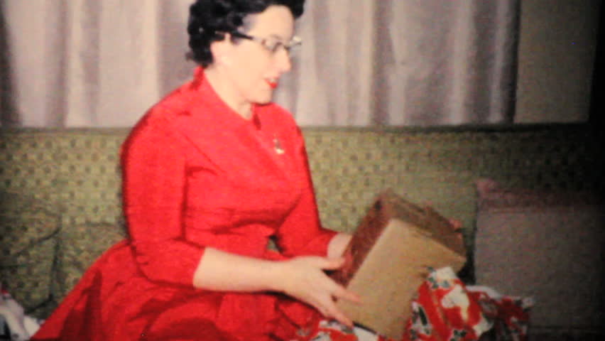 JOHNSTOWN, NEW YORK, 1960: An attractive woman gets a beautiful necklace for Christmas in 1960.