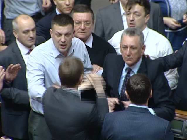 KIEV - MARCH 18: Fight on parliament floor between Nationalists and Communists in Kiev, Ukraine on March 18, 2013.