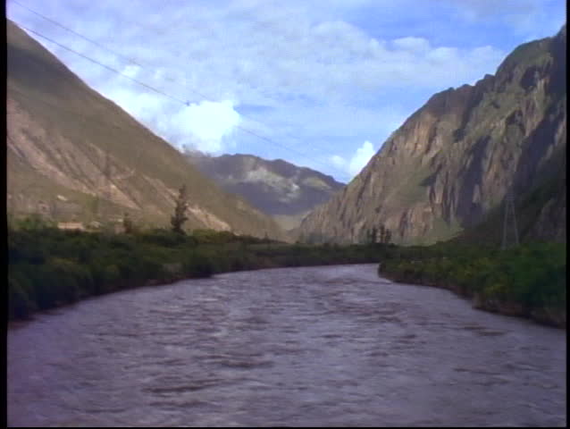 Peru, train ride through Andes on narrow gauge, POV crossing river