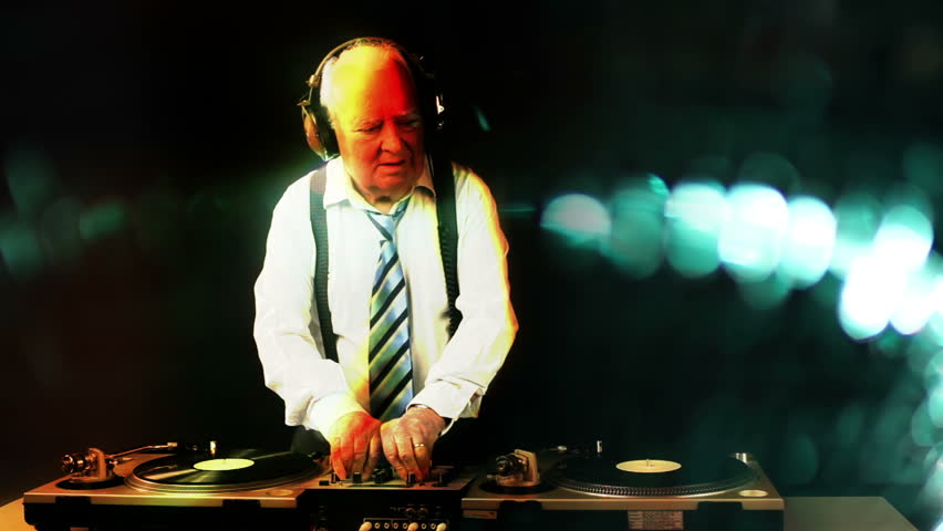 a very funky elderly grandpa dj mixing records

