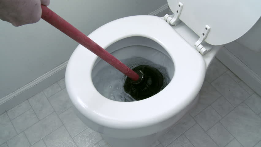 Using A Plunger In An Attempt To Unclog A Toilet. Close View With ... Using A Plunger In An Attempt To Unclog A Toilet. Close View With ...