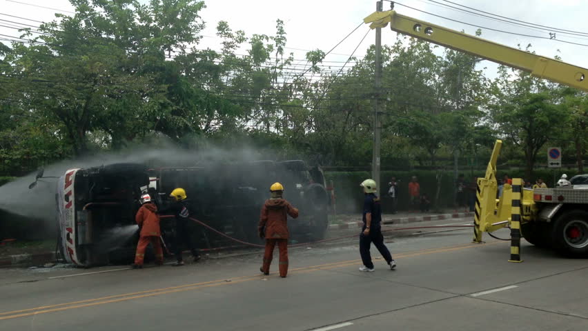BANGKOK - APRIL 15: A rolled-over gas truck is being craned back on wheel in Bangkok, Thailand, on April 15, 2013. The gas truck crashed after a brake failure
