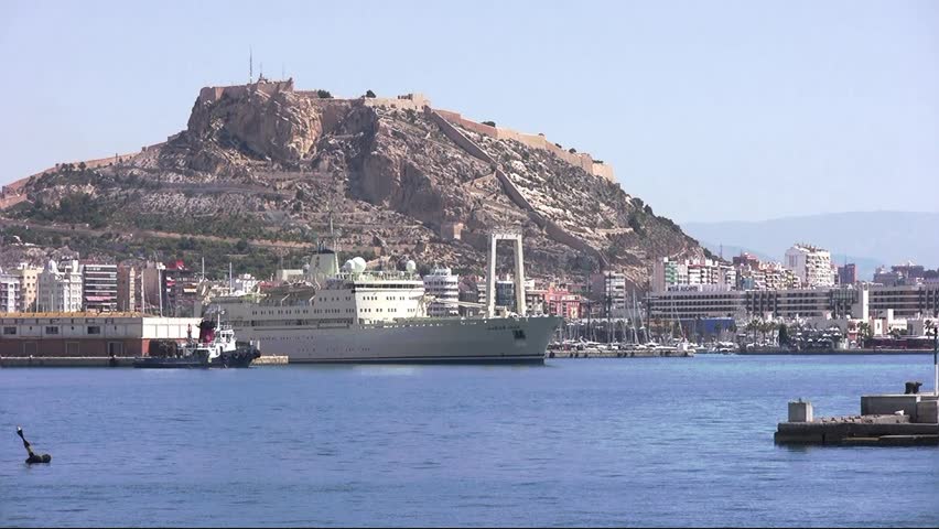 ALICANTE, SPAIN â JANUARY 20: The general cargo vessel "AL SALAMAH" is leaving the port of Alicante helped with tugs, on January 20, 2013 in Alicante.