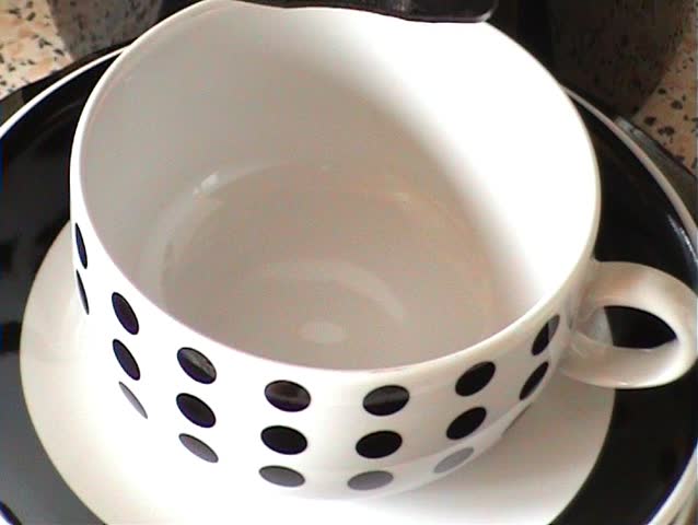 A fresh brewed coffee is filled in the cup.