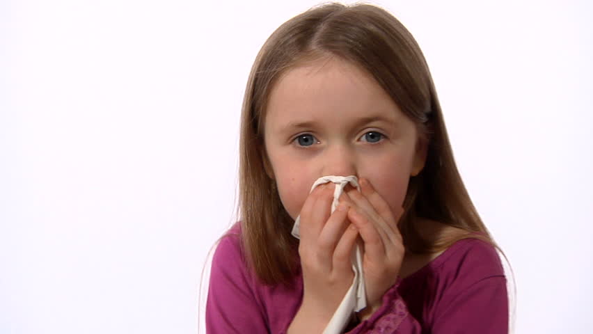 Little girl sneezing - Camera dollies out and back in as she catches a sneeze in a tissue, put it in a bin and then kills the germs with hand sanitizer