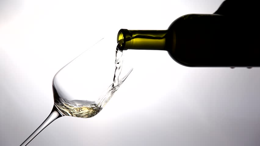 Bottle pouring white wine on a white background.