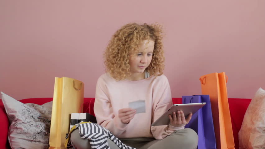 Young woman looking over bills
