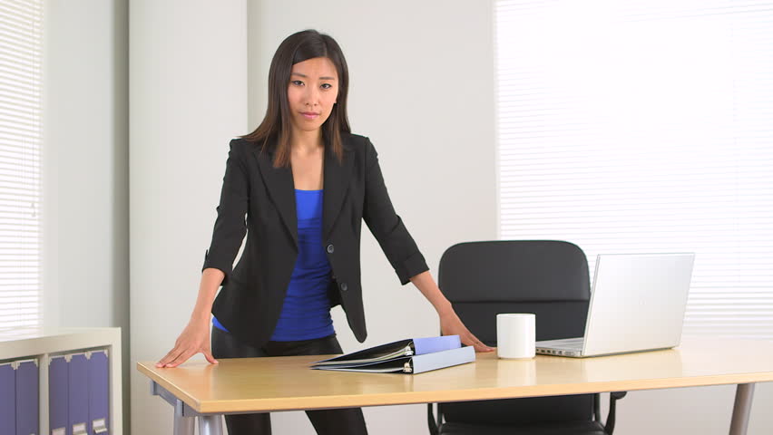 Asian businesswoman standing in office