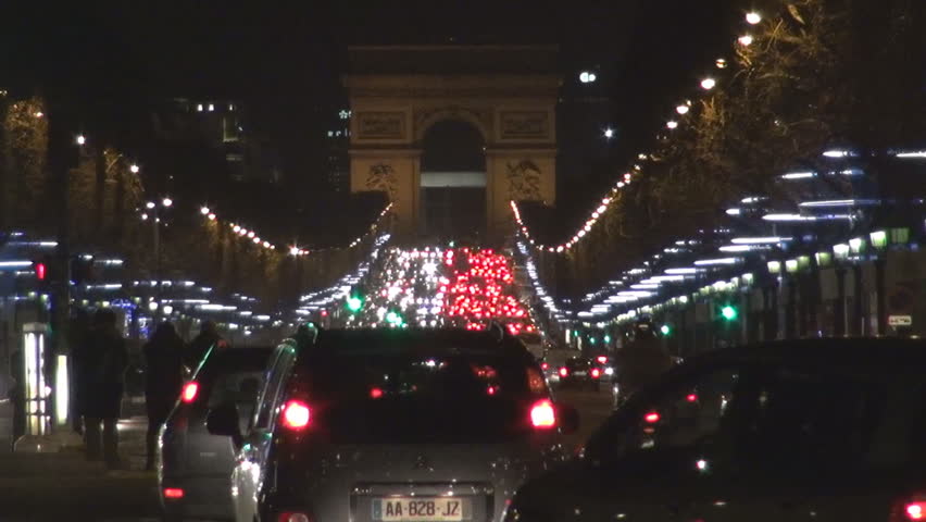 PARIS, FRANCE - DECEMBER 25, 2011, Traffic car and The Arc de Triomphe in Paris by night