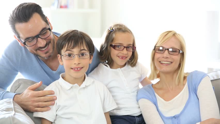 Family of four wearing eyeglasses