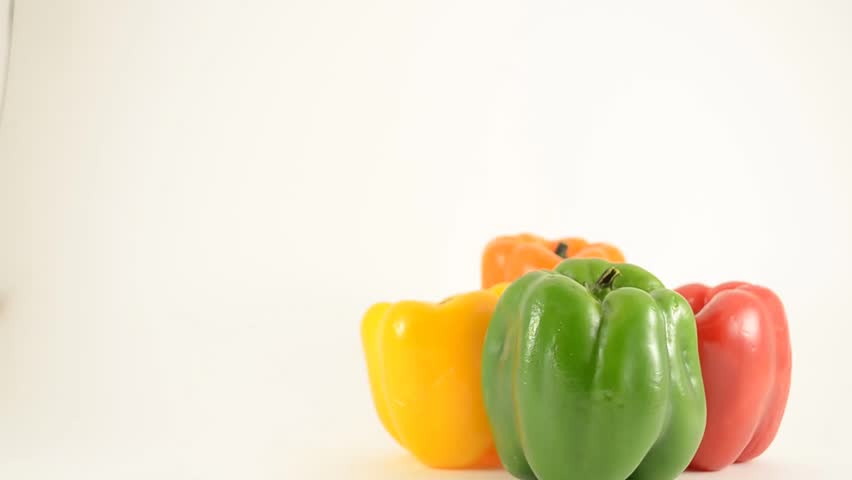 Green, Yellow, Red and Orange Peppers Against White - Diamond Arrangement - Crane Down