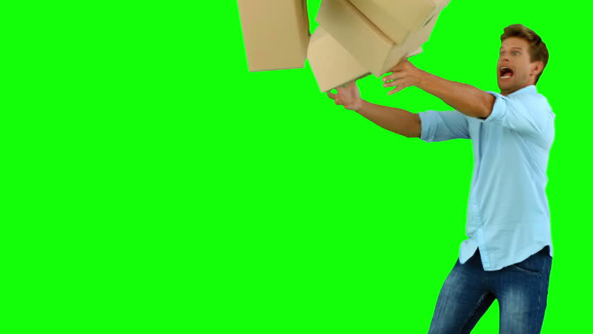 man drops boxes, greenscreen