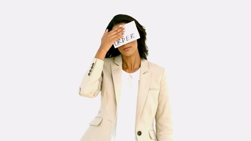Exhausted businesswoman sticking out of order sign on her forehead in slow motion