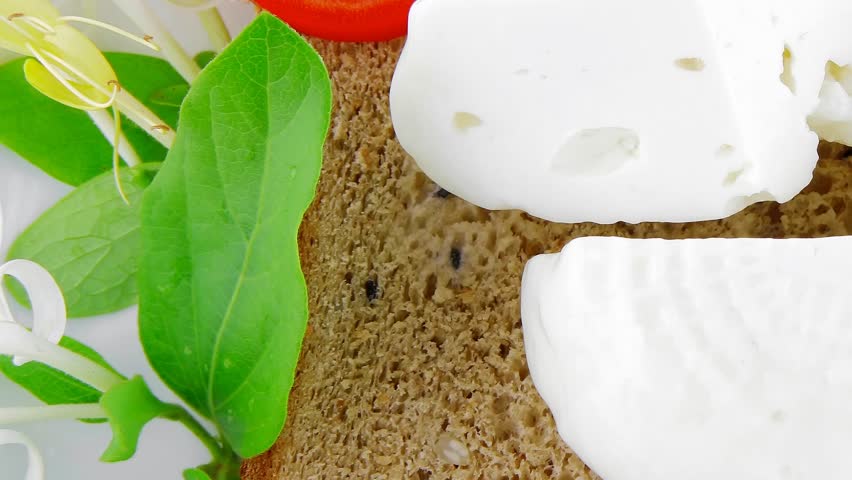 light feta and tomatoes on big white plate 1920x1080 intro motion slow hidef hd