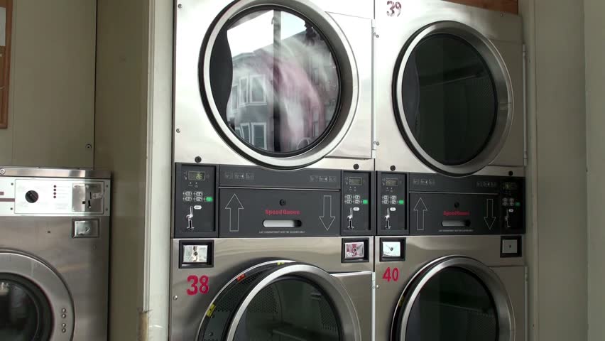 Work of the Front-loading washing machine at laundromat